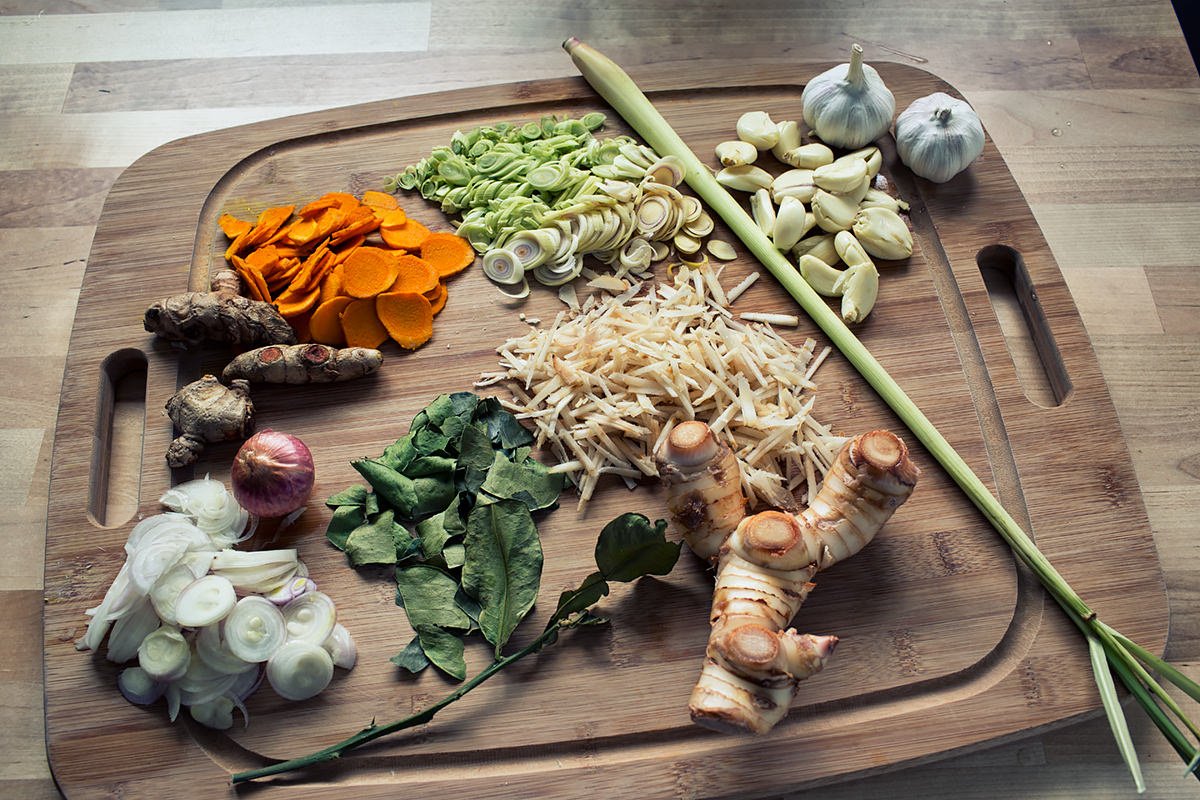 Ingredients for Kroeung or Cambodian lemongrass paste recipe all chopped up on a cutting board
